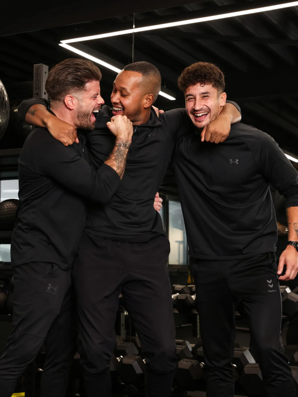 Stiven, Peter en Roy van All-in Lifestyle samen in de gym in Haarlem